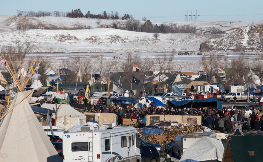 On Sunday, protesters gather at their camp as news breaks that the Army Corps of Engineers will not approve an easement for the Dakota Access Pipeline.