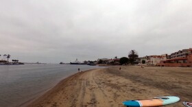 People on Kellogg Beach on a cloudy day, June 2020.