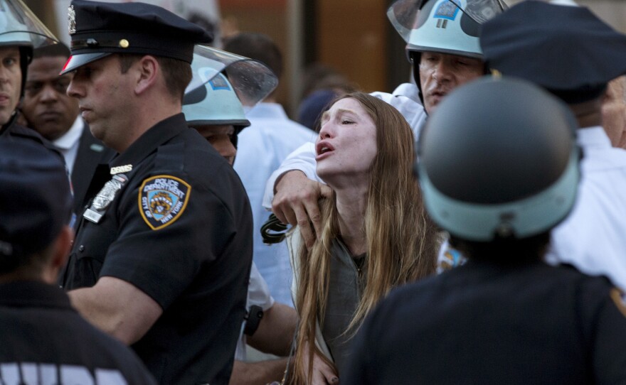 A protester screams Wednesday as she is detained by New York police during a demonstration in the Manhattan borough of New York. Billed as "NYC Rise Up & Shut it Down With Baltimore," the demonstration was being held to support Baltimore's protests against police brutality.