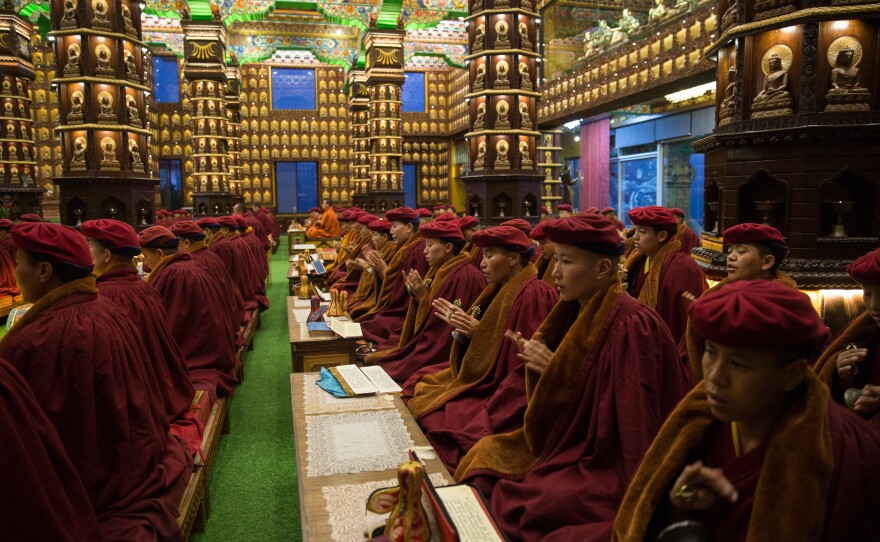 The nuns participate in morning meditation.