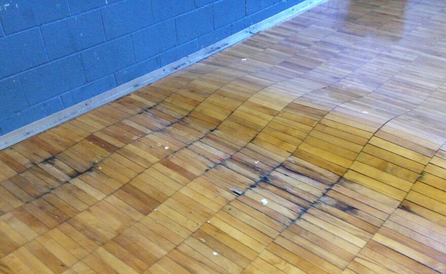 Disrepair — such as this floor in the gym of Noble Elementary-Middle School in Detroit — and other problems have prompted the teachers' "sickout" protests.