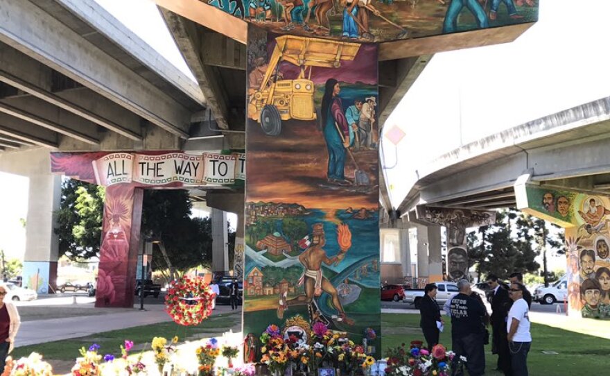 A growing memorial for the four people killed in Chicano Park after a car plunged off the Coronado Bridge, Oct. 18, 2016.