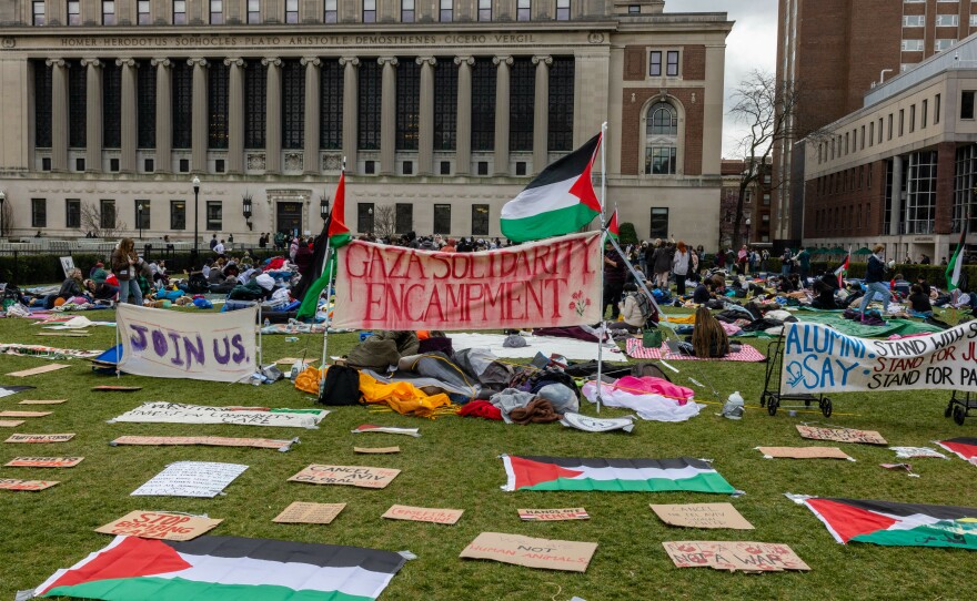 Students occupy the campus Columbia University on Friday, calling for the school to divest from companies with ties to Israel.