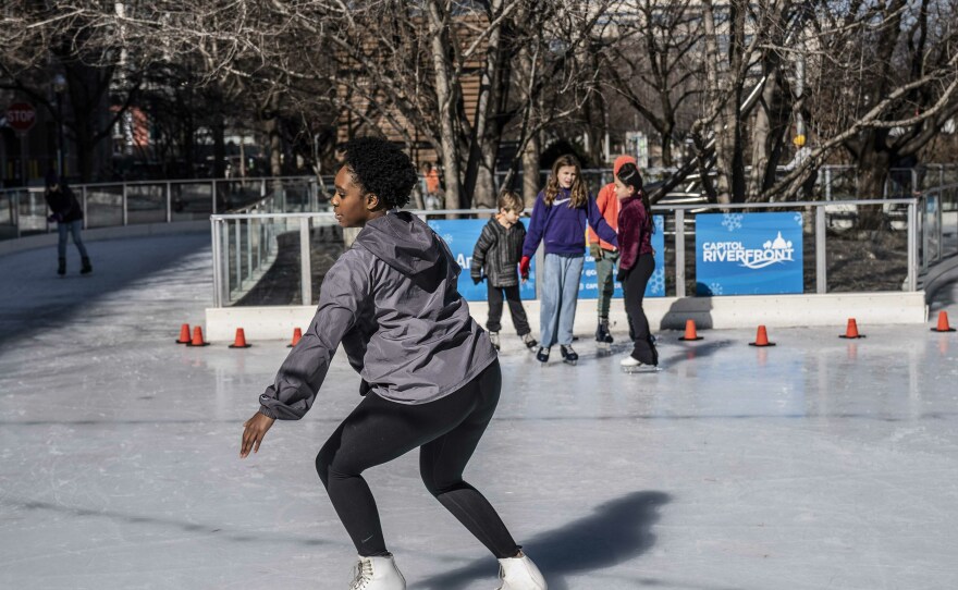 Cheyenne Walker, Co-Founder and Vice President of Howard University Ice Skating Organization prepares to perform a scratch spin at Canal Park Ice Rink in Washington, D.C.