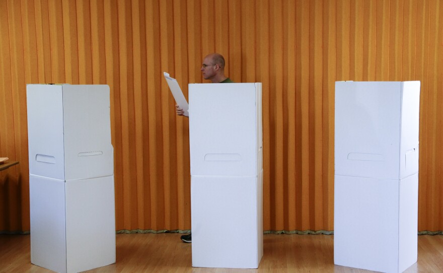 A man casts his ballot during elections in San Diego, Nov. 4, 2014.