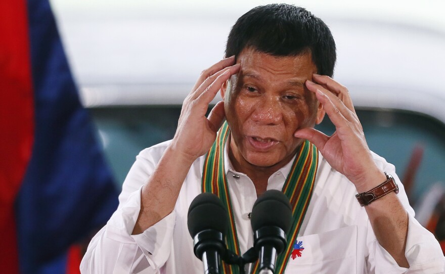 Philippine President Rodrigo Duterte addresses army troops near Manila on Tuesday. As the U.S. and the Philippines began annual military exercises, the president said it might be for the last time, adding that, "Mr. Obama, you can go to hell."