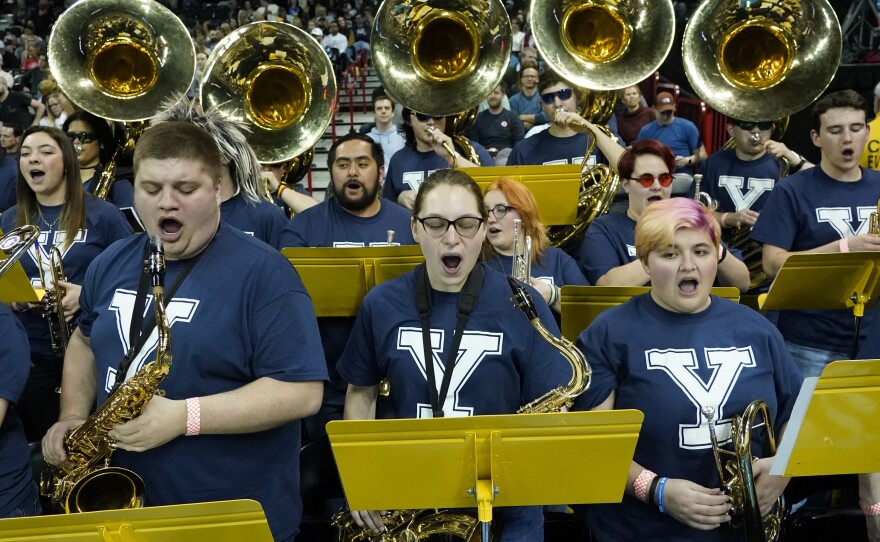 The University of Idaho Marching Band, wearing Yale T-shirts, performs at the NCAA Tournament game between Yale and San Diego State in Spokane, Wash., on Sunday. The band has been honored in Connecticut for filling in as Bulldogs.