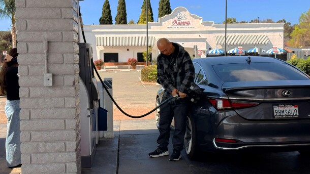 Man pumps gas as prices rise at a Chevron station in Chula Vista in San Diego County on March 5, 2026.
