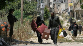 Palestinians collect their belongings from their evacuated homes after the Israeli army issued a number of short term access permits for residents of the occupied West Bank refugee camp of Tulkarem, Wednesday, June 17, 2026.