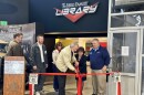 Jim Berg, Sharon Dunn, and Lenny Leszczynski handle the official ribbon-cutting opening of the Berg Family Trust Library, Tuesday, at the San Diego Automotive Museum in Balboa Park, San Diego, Calif., January 16, 2024