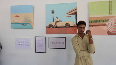 Fredo Gillis stands in front of his paintings at San Diego Made Factory on Sept. 22, 2026.