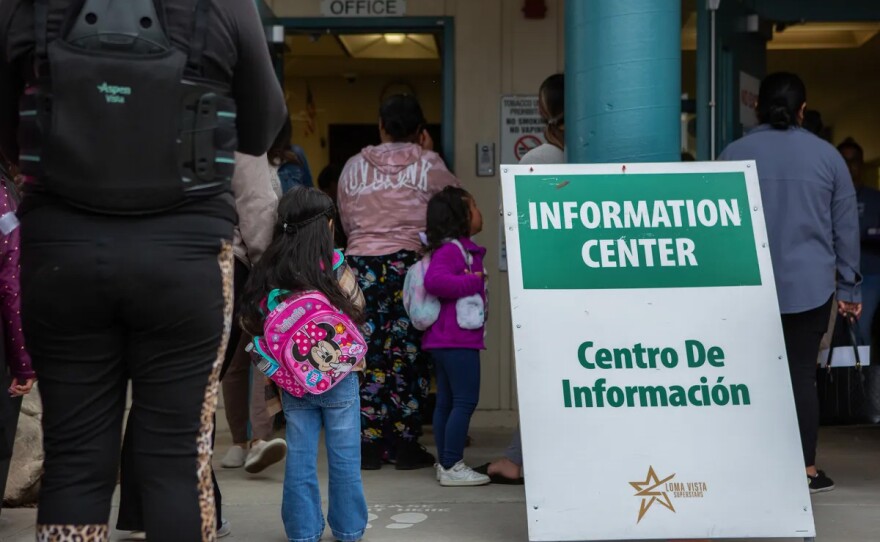 Parents and their kids on the first day of classes at Loma Vista Elementary School in Salinas on Aug. 8, 2023. State legislators want to limit deportation actions at schools.