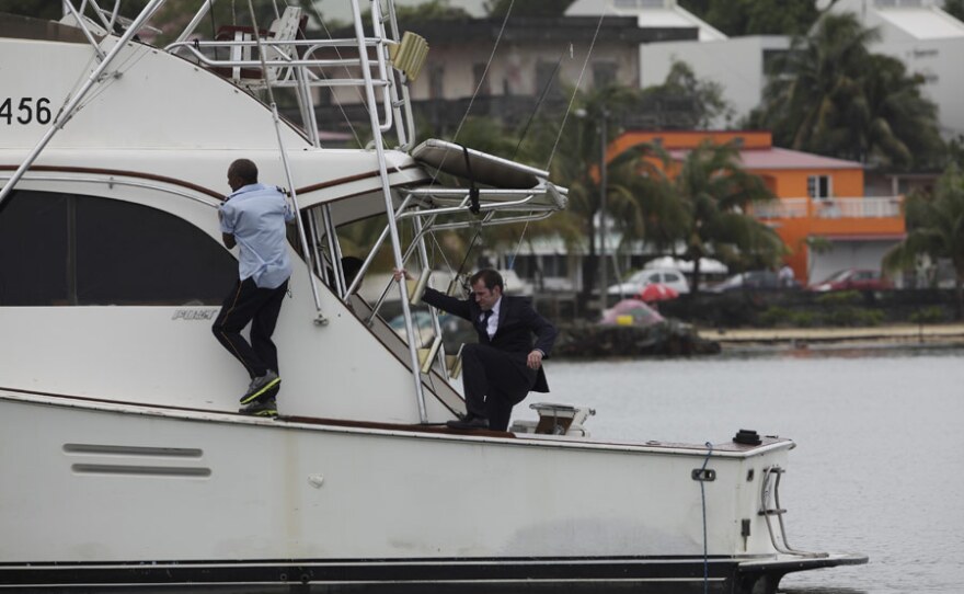 Danny John-Jules as Dwayne Myers and Ben Miller as DI Richard Poole investigate a crime on a boat in DEATH IN PARADISE.