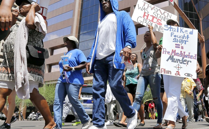 Marchers aligned with the Justice for Trayvon Martin movement called for a federal civil rights action to be filed against George Zimmerman in Phoenix on Monday. Zimmerman was found not guilty in the shooting death of Trayvon Martin.