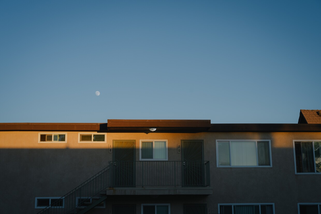 The moon rises over the Hawaiian Gardens apartment complex in Imperial Beach, California on November 13, 2024. Dozens of longtime tenants are facing eviction, but city leaders are also weighing local protections.