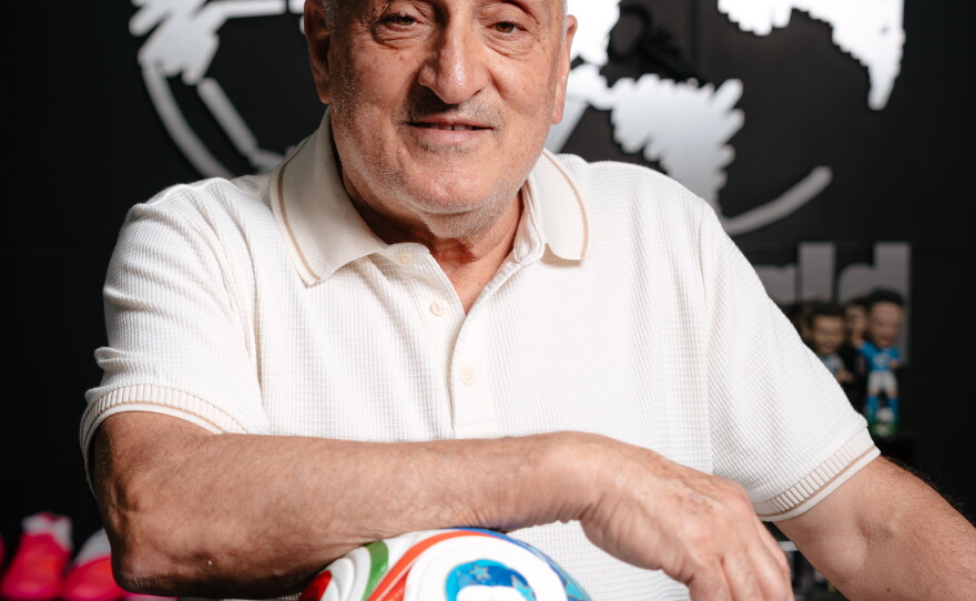 Waad Sana poses with the official FIFA 2026 World Cup "Trionda" soccer ball at his store Soccer World in Rochester Hills, MI on June 10, 2026.