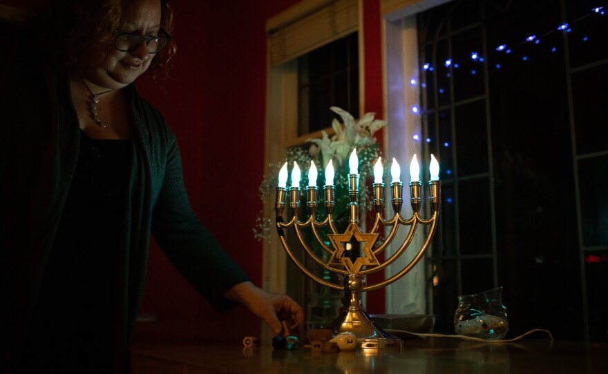 Beth Richman lights up her menorah in her home in Portland, Ore. Like many in the American Jewish community, Richman is concerned about the rising currents of antisemitism. She says putting her electric menorah in her window feels like an important act of resistance.