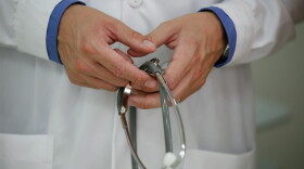 A healthcare provider holds a stethoscope in this photo, taken March 25, 2012. 