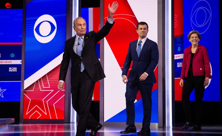 From left: Former New York City Mayor Mike Bloomberg, former South Bend, Ind., Mayor Pete Buttigieg and Massachusetts Sen. Elizabeth Warren take the stage before the Democratic debate.