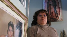 Olga Esparza Rodriguez stands next to a photo of her daughter, Monica, who disappeared in Ciudad Juarez, Mexico, in March 2009. Monica is among the hundreds of women and girls who have disappeared from the violence-plagued border city over the past two decades.