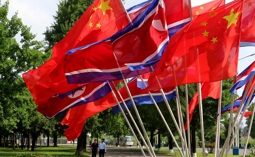 A street is decorated with the flags of China and North Korea in Pyongyang, on Monday, June 8, 2026.