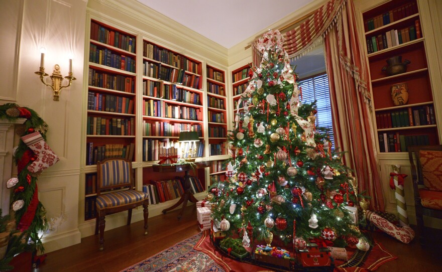 A Christmas tree decorates the library.