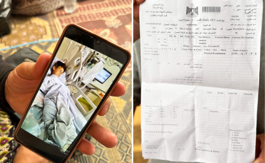 Nimer's grandmother Salwa Yusuf Mahmoud Mashaa shows NPR a photo of Nimer at the Soroka hospital in Be'er Sheva, Israel. Medical records reviewed by NPR show that Nimer is suffering from a fractured femur and vertebrae, loss of motor function in his foot and swelling along his sciatic nerve. Records indicate there is still shrapnel left inside Nimer's abdomen and backside.