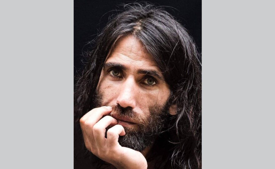 Behrouz Boochani, a Kurdish-Iranian journalist and asylum-seeker, won two prestigious Australian literary prizes for his debut, a book composed in text messages sent from a detention center on Manus Island.