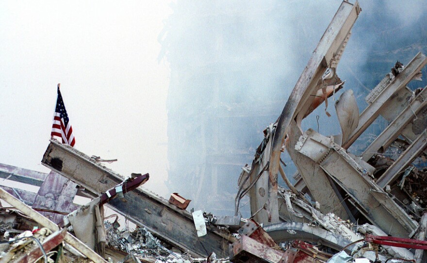 Sept. 13, 2001: An American flag, put there by rescue workers, stands in the wreckage of the World Trade Center.