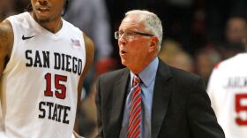 In this photo taken, Saturday, Feb. 5, 2011, San Diego State coach Steve Fisher directs Kawhi Leonard during an NCAA college basketball game in San Diego. 
