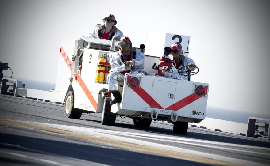 Emergency fire and rescue crew get into place before the F-35B launch on Nov. 6, 2024 off the coast of San Diego, Calif.