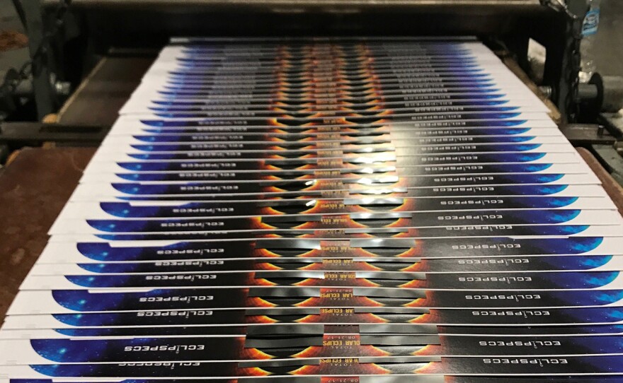 Eclipse viewers on the production line at an American Paper Optics facility. The company says it has already sold 65 million of these viewers for the upcoming total solar eclipse.