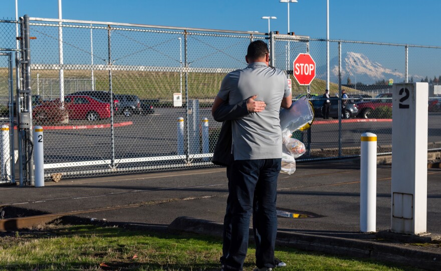 On the day he is released, Manuel is hugged by a friend at the detention center. The fact that he had a lawyer greatly improved his chances of avoiding deportation.