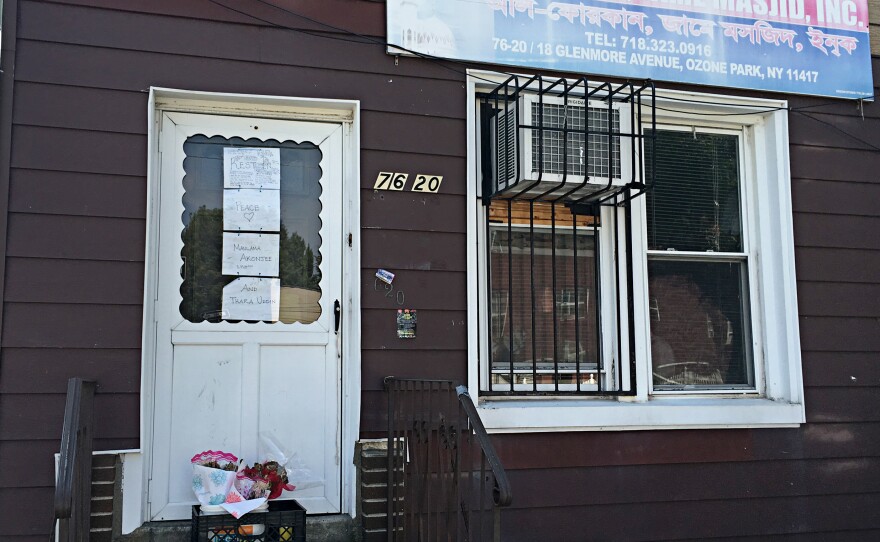 Bangladeshi imam Maulama Akonjee and an associate were shot from behind on a busy street on a Saturday afternoon. Signs reading "Rest in Peace" adorn the door of Al-Furqan Jame Masjid, where Akonjee was the imam, in Ozone Park, Queens.
