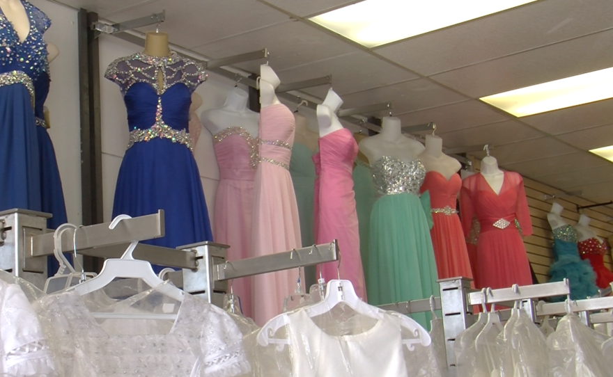 The formal dress shop in San Ysidro, Princesa, has seen a decline in sales due to the weakening peso. 