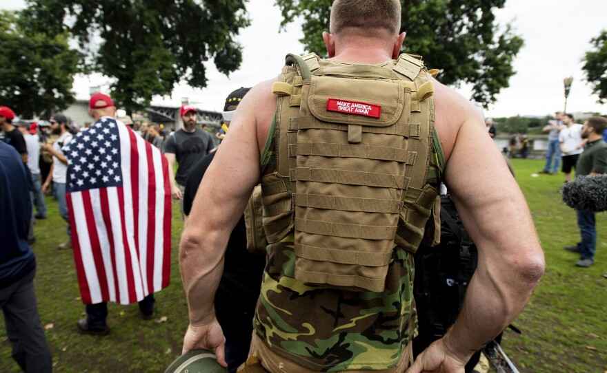 A member of the Proud Boys wears body armor during a rally in Portland, Ore., in August 2019.