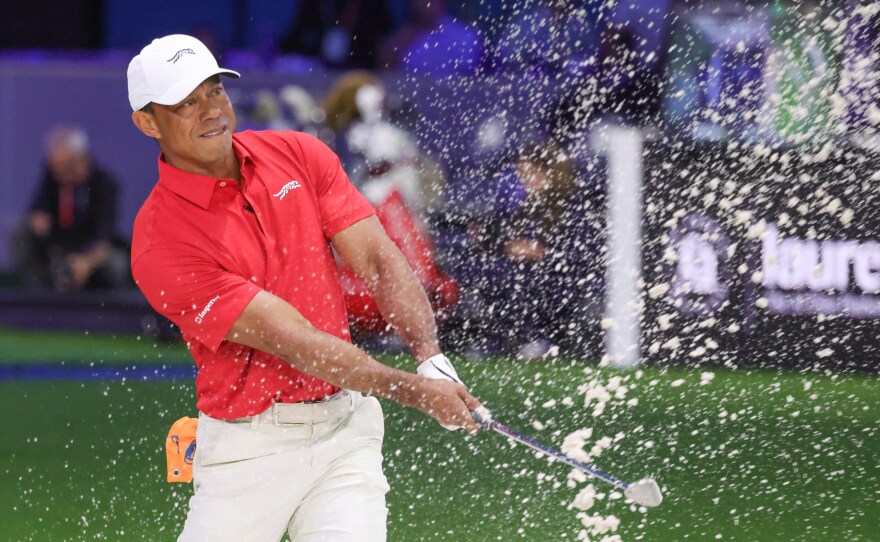 Tiger Woods of the Jupiter Links Golf Club plays a shot from a bunker on the eighth hole, during final day of TGL golf tournament, Tuesday, March 24, 2026, in Palm Beach Gardens Fla.