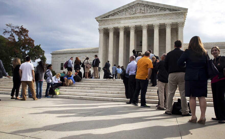 People line up outside the Supreme Court Tuesday, before the justices hear arguments in Montgomery v. Louisiana.