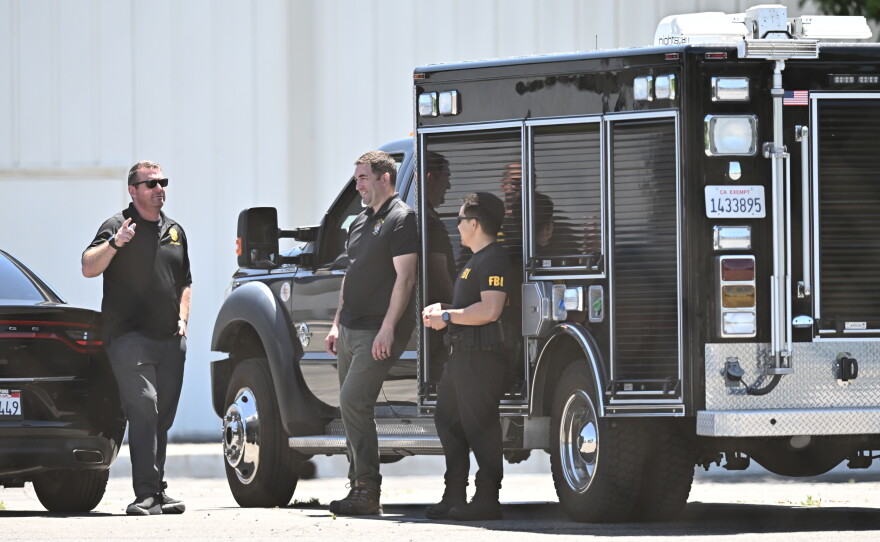 FBI agents stage at GKN Aerospace in Garden Grove, Calif., on Wednesday.