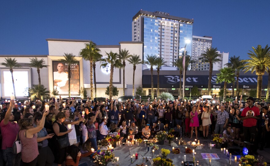An October vigil is held one week after the mass shooting in Las Vegas. Newly unsealed documents reveal details of the early stage of the investigation.