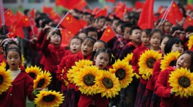 Chinese children celebrate the Communist Party in Chongqing municipality in March. Bo Xilai, the region's party secretary who is vying for a place in the Politburo Standing Committee, espouses a government-intervention model to economics.