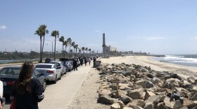 Cars parking on the street in Carlsbad next to the beach on April 2, 2020.