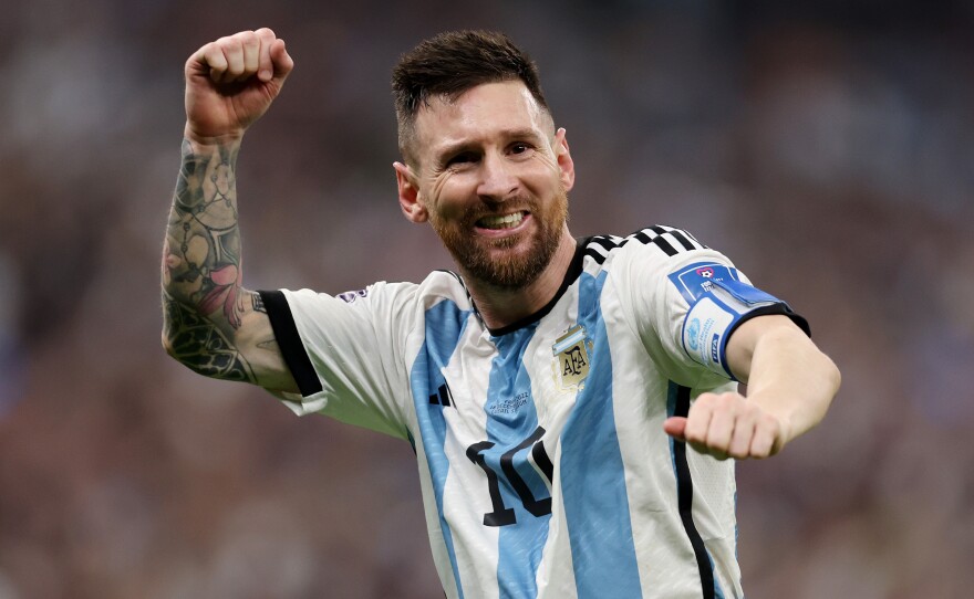 Lionel Messi of Argentina celebrates after scoring the team's third goal during the FIFA World Cup Final match between Argentina and France on December 18, 2022 in Lusail City, Qatar.