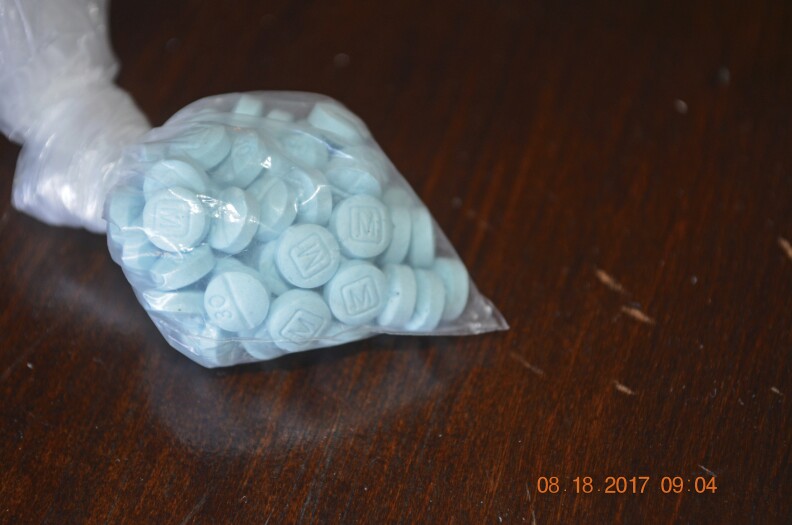 This undated photo provided by the U.S. Drug Enforcement Administration's Phoenix Division shows a closeup of the fentanyl-laced sky blue pills known on the street as "Mexican oxy.