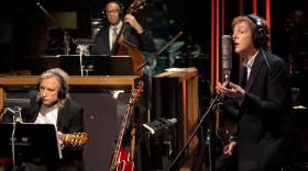 Musicians Joe Walsh, John Clayton and Paul McCartney rehearsing.