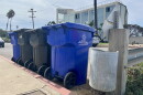 Recycling and trash cans sit curbside in Ocean Beach, San Diego on Sept. 17, 2025.