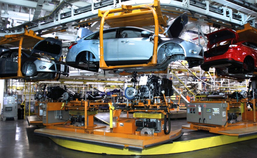 Workers build cars on the assembly line at the Ford Motor Co.'s Michigan Assembly Plant in Wayne, Mich., in December. As auto sales boom, parts suppliers are having a tough time finding the labor they need to catch up, having lost workers during the recession.