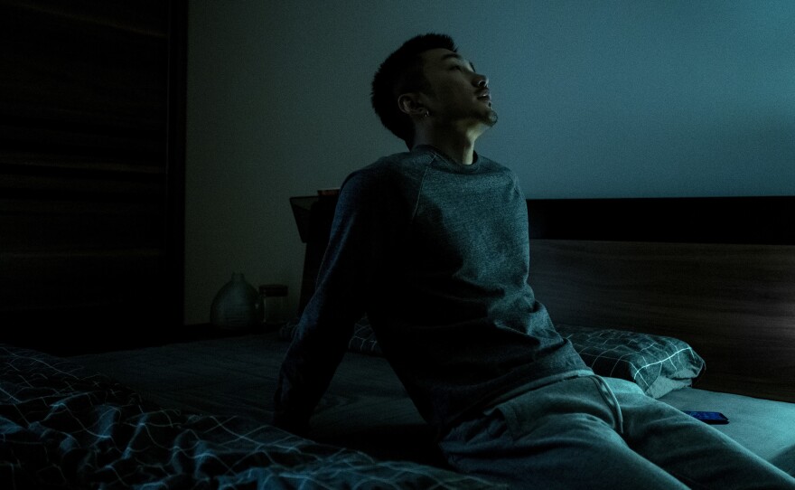 Dan Dan in his bedroom in Shanghai. He has moved from a small city in Guangdong province to feel free from his traditional family. He wishes to come out with his parents, but he's afraid of their reaction.