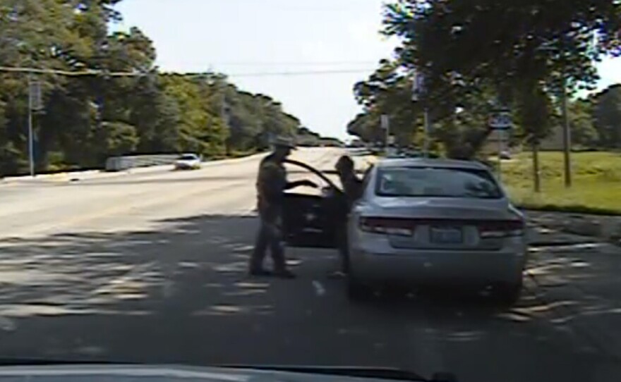 In this frame from the dashcam video Texas State Trooper Brian Encinia confronts Sandra Bland after a minor traffic infraction. She was later arrested and found hanged in her jail cell.