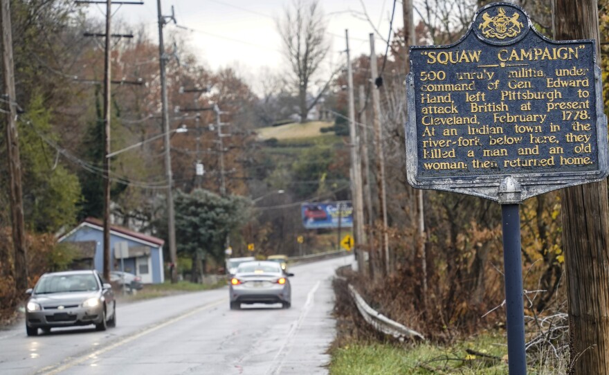 A Pennsylvania Historical and Museum Commission plaque is seen along a roadside in New Castle, Pa. A recent review of all 2,500 markers has resulted in the state removing two markers, revising two and ordering new text for two others so far.